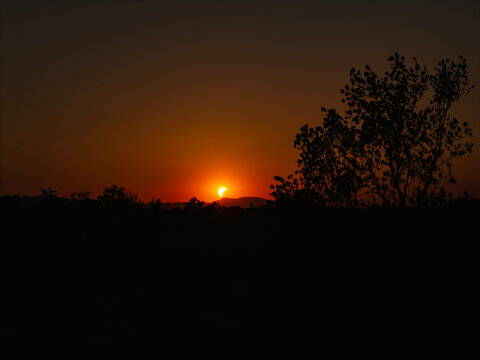 Partial solar eclipse in 2026 at the city of Zagreb, Croatia when moon covered part of the sun at sunset