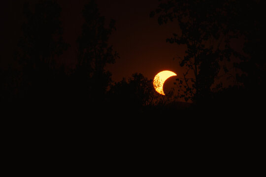 Partial solar eclipse in 2026 at the city of Zagreb, Croatia when moon covered part of the sun at sunset