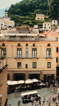 Amalfi town, main square, buildings, and tourists in summer