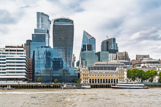 View of the London skyline featuring the Walkie Talkie building, modern glass skyscrapers, and historic architecture along the River Thames in London, England, United Kingdom.