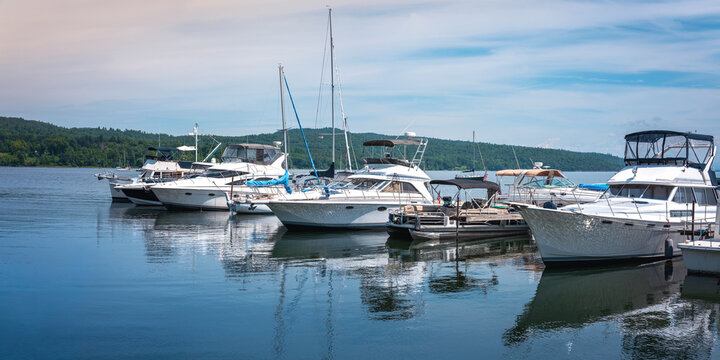 Lake Champlain summer landscape with moored boats and yachts in New York