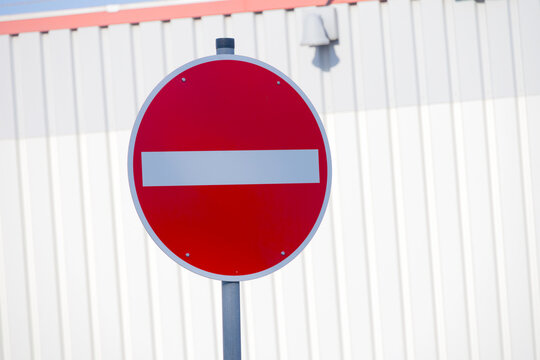 Road sign prohibiting entry, showing restriction and warning