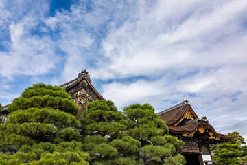 Fototapeta premium Traditional entrance architecture of Nijo Castle in Kyoto surrounded by stone courtyard and historic wooden walls, Kyoto, Japan 