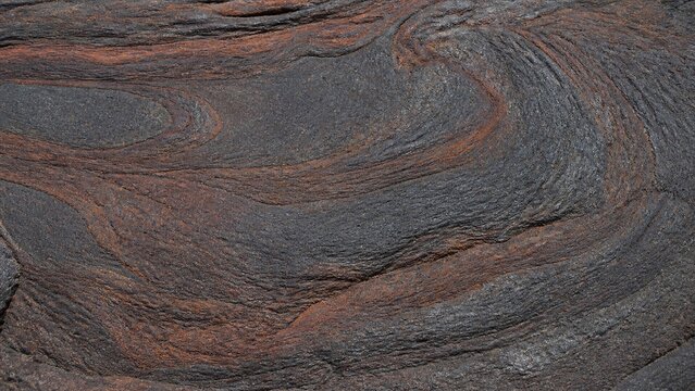 溶岩のテクスチャ 黒褐色の太い縞が流れる岩の背景素材