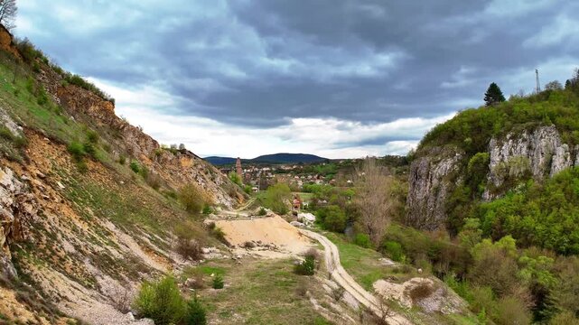 Aerial 4K Drone View of Zemen Gorge Canyon with Dramatic Rocky Formations and Cloudy Sky in Bulgaria