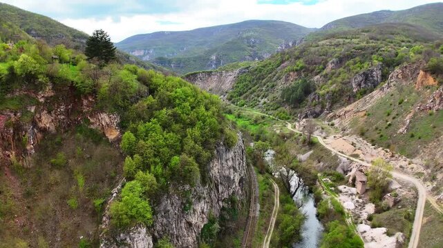 Aerial 4K Drone Panoramic View of Zemen Gorge River Between Rocky Limestone Cliffs Bulgaria
