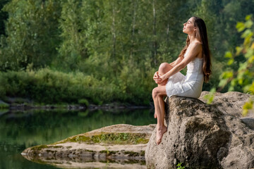 Fototapeta premium A Lovely Model Poses Outdoor While Enjoying The Summer Weather