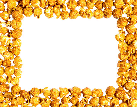 Top down view of a lot full caramel popcorn arranged as a frame, golden caramel-coated kernels creating a border, isolated on transparent background, perfect for movie nights.