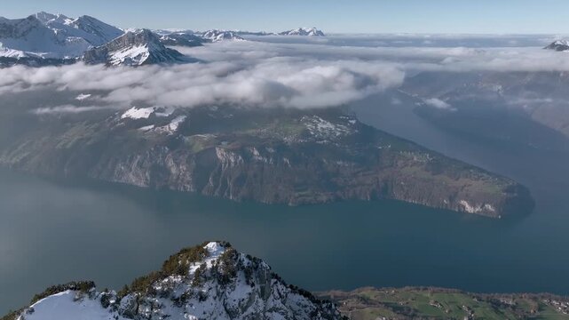 Aerial Drone View of Lake Lucerne from Fronalpstock Summit with Swiss Alps Winter Panorama