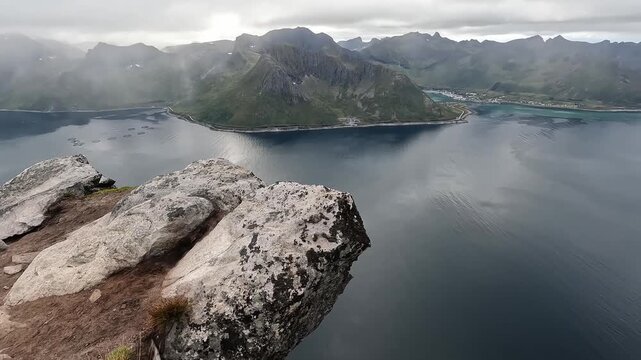 Aerial Drone View of Norwegian Fjord from Rocky Summit of Segla Mountain in Northern Norway