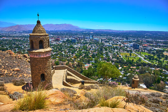 Mt Rubidoux Tower Overlooking Riverside Cityscape with Mountains in California