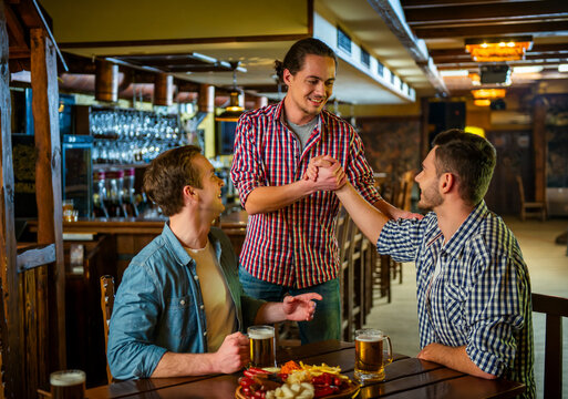 Friends Greeting at Pub.