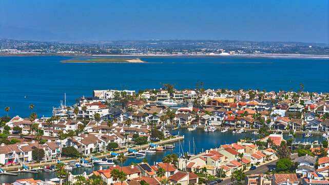Aerial San Diego Bay Waterfront Homes and Boats with Coastal California Cityscape