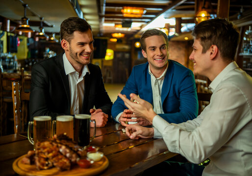 Businessmen Socializing Over Beer.