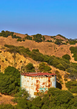 Abandoned Water Tank in Griffith Park Surrounded by Hills and Brush in Los Angeles
