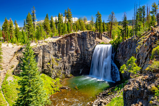 Rainbow Falls dropping over volcanic cliff into pool at Devils Postpile National Monument California