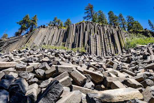 Columnar basalt rock formation and talus slope at Devils Postpile National Monument California