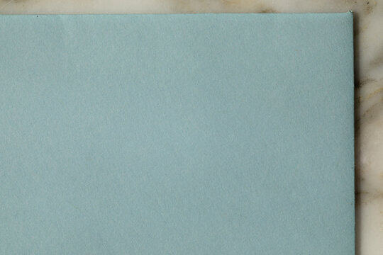 edge of pale blue paper envelope
