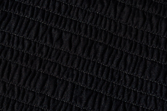smocked black fabric close up texture