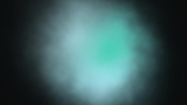 Abstract emerald green glowing smoke texture with ambient soft light against dark background creating mysterious atmospheric mood