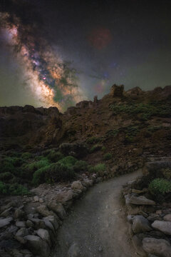 View of the Queen's Shoe rock formation under the Milky Way in the volcanic landscape of Teide National Park in La Orotava, Canarias, Spain.