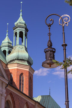Historic Church Towers and Street Lamp in Poznan, Poland