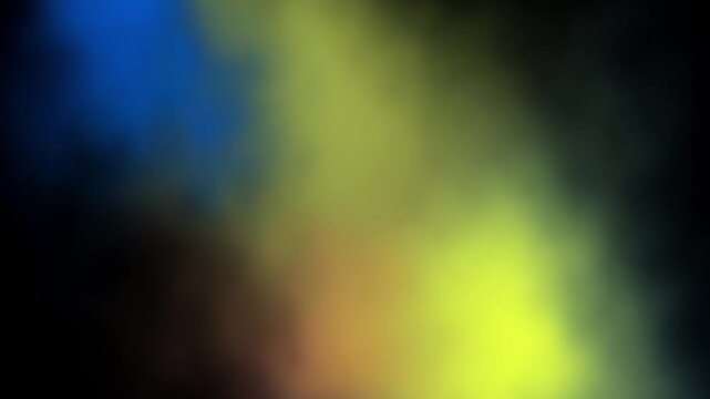 Vibrant abstract colorful smoke haze with glowing blue yellow light rays on dark background for mysterious dramatic atmospheric mood