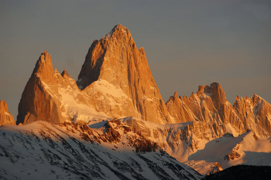 Famous Mount Fitz Roy glowing at sunset above snowy peaks in El Chalt&eacute;n, Patagonia, Argentina.
