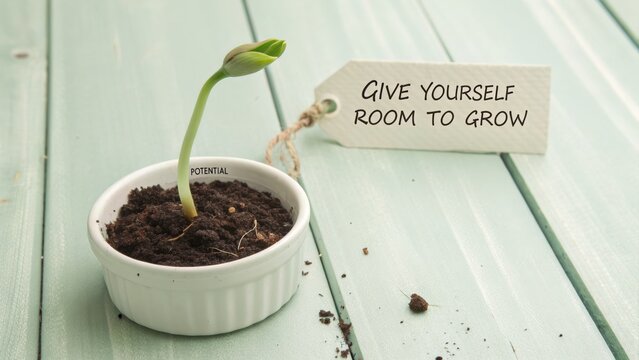 Seedling in White Bowl with Tag Saying Give Yourself Room to Grow