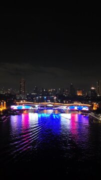 Phra Pok Klao Bridge Illuminated at Night in Bangkok, Thailand