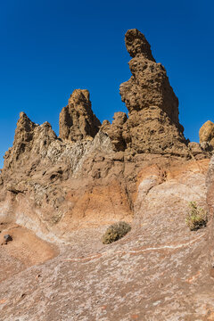 View of Mount Teide volcanic rock formations under a clear blue sky in Santa Cruz de Tenerife, Canary Islands, Spain.