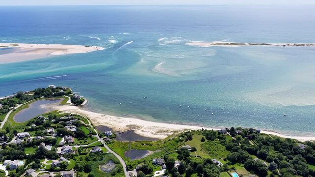 The Atlantic Ocean washes against the beautiful coast of Chatham on Cape Cod, Massachusetts. This outer Cape is a popular and scenic east coast vacation destination during summer months.