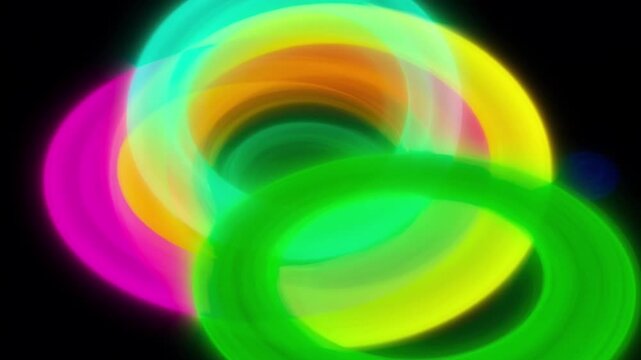 Glowing neon rings swirling in dark space create hypnotic abstract motion patterns captured within this vibrant digital light animation clip
