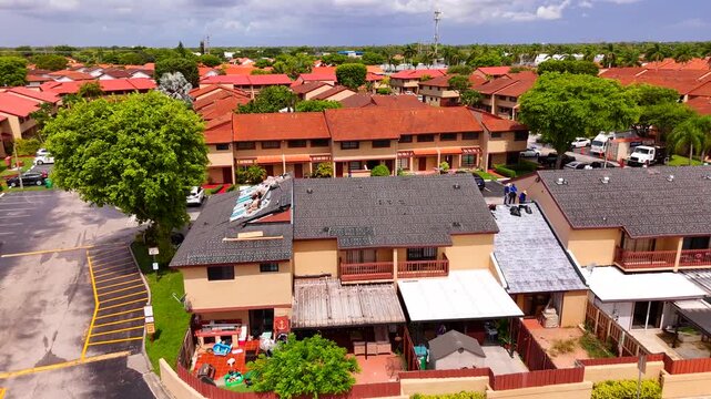 Roofers working on roofs in Kendall Miami