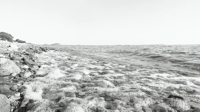 Gentle Waves on a Pebble Beach in Japan