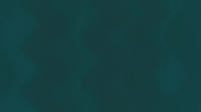 Solid dark teal surface with subtle organic variations in tone