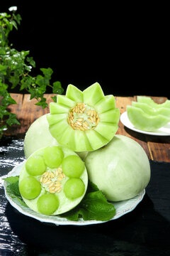 Fresh Green Melons Artistically Carved and Plated - Traditional Asian Fruit Presentation