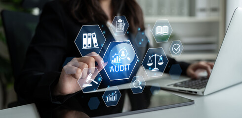Professional auditor analyzing data with digital icons representing audit, compliance, legal...