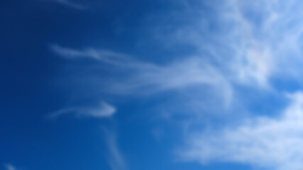 Obraz premium The background is blurred. A delicate celestial landscape or environment, a blurred blue sky and a cloud.