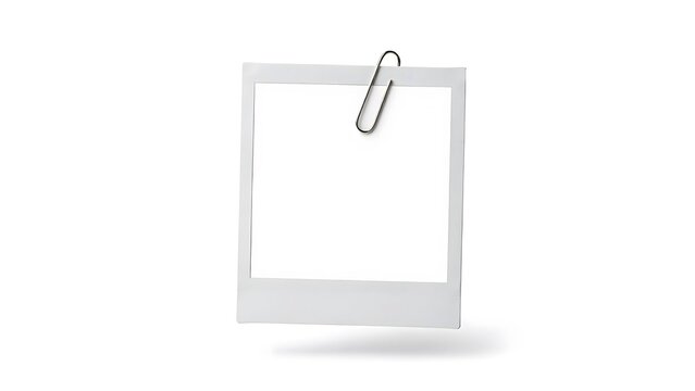Empty white instant photo frame with a silver paperclip isolated on white background