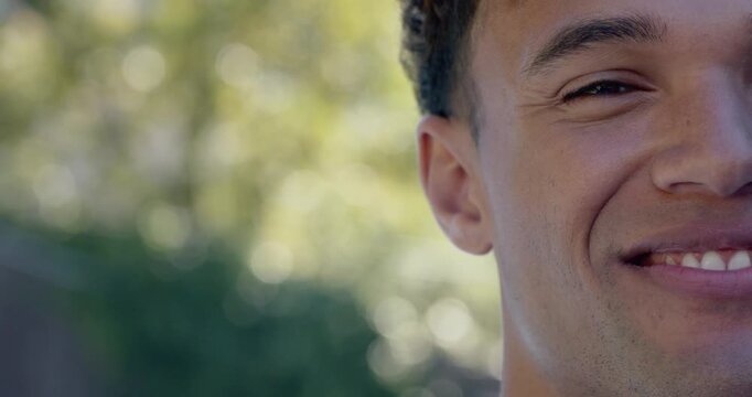 African American man going from neutral to laughing with camera holding tight by fence, copy space