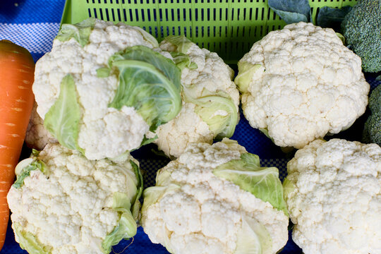 Fresh cauliflower heads at a local market stall