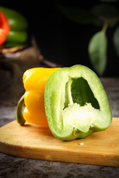 Fresh Sliced Bell Peppers on Wooden Board - Colorful Sweet Variety for Cooking and Food Production