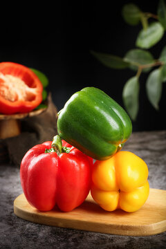 Three Fresh Sweet Bell Peppers Red Green Yellow on Wooden Board Healthy Vegetables