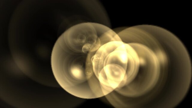 Large Golden Overlapping Glowing Bokeh Circles on Dark Background.Several large, out-of-focus golden light circles overlap against a black background. The soft lighting creates a warm, festive.