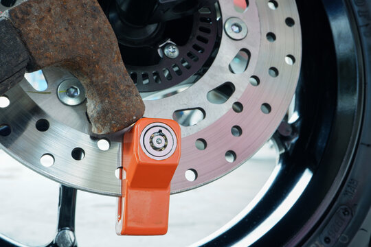​Motorcycle Theft Attempt with Hammer Hitting Disc Brake Lock for Security Test and Protection Concept