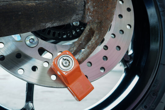 ​Motorcycle Theft Attempt with Hammer Hitting Disc Brake Lock for Security Test and Protection Concept