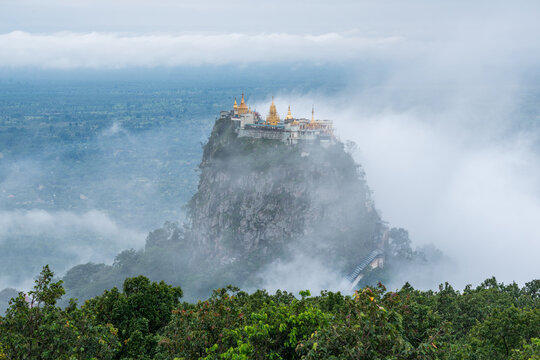 Mount Popa covered by fog. Mt.Popa is the home of "Nat" the Burmese mythology ghost. This place is the old volcano in Myanmar.