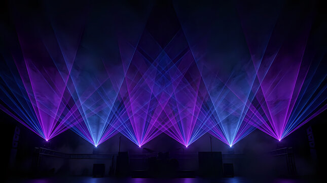 Abstract laser light show with beams of purple and blue creating geometric patterns abstract geometric lighting
