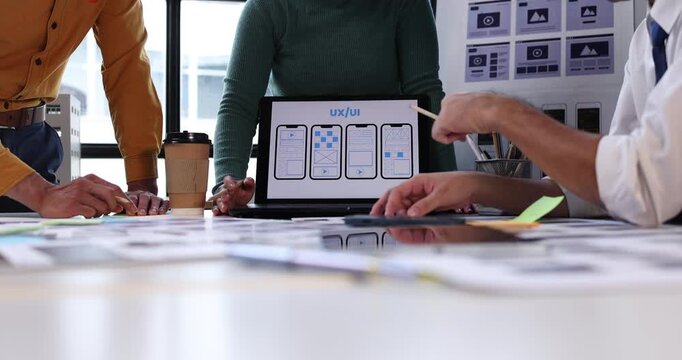 Design team hands actively working on ui ux design, planning and prototyping responsive web and mobile application development